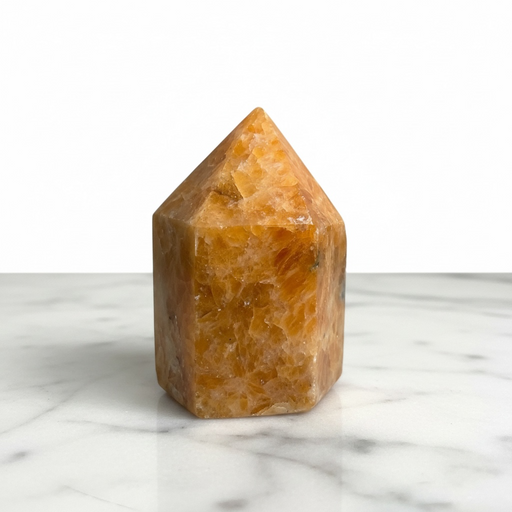 Kindred Crystal Collective — Orchid Calcite Generator, polished warm amber-orange orchid calcite generator point, front view on white background