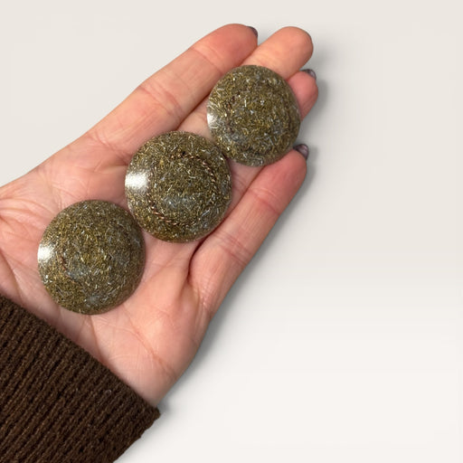 Kindred Crystal Collective — Orgonite EMF Harmoniser Disc, three handcrafted palm-sized resin discs with gold metal shavings, size reference held in open palm