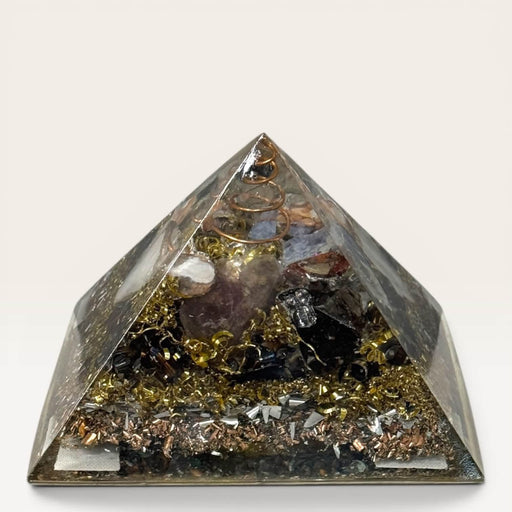 Kindred Crystal Collective - Handcrafted orgonite pyramid with copper spiral, crystal chips, natural minerals and mixed metal shavings in layered high-gloss resin, for meditation spaces and crystal decor