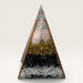 Kindred Crystal Collective — Orgonite Pyramid, handcrafted clear resin pyramid with layered clear quartz, black obsidian, brass shavings, copper frame and multicoloured spiral apex, white background