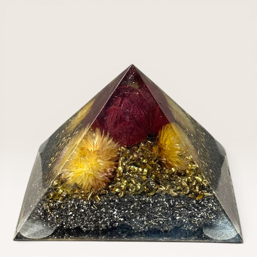 Kindred Crystal Collective - Handcrafted orgonite pyramid with preserved dried flowers, copper, crystal chips and metal shavings in high-gloss resin, for meditation spaces and intentional living