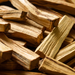 Kindred Crystal Collective — Palo Santo Natural Wood Incense, golden-brown aromatic wood sticks with natural grain.