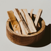 Kindred Crystal Collective — Palo Santo Natural Wood Incense, bundled palo santo sticks with varied lengths and natural wood texture.