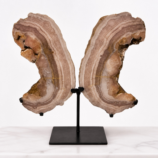 Kindred Crystal Collective — Pink Amethyst Wings, natural pink amethyst wing pair with soft blush druzy crystal surface on black metal display stands, 42cm tall