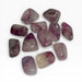 Kindred Crystal Collective — Purple Fluorite Tumbled Stones, twelve polished pale lavender to soft purple Fluorite tumbles showing translucent banding and cream-white zones with high-gloss finish, white background