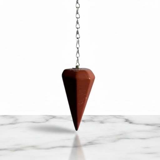 Natural red jasper faceted pendulum in deep earthy red tones, used for dowsing and grounding