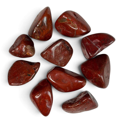 Kindred Crystal Collective — Red Jasper Tumbled 3cm, rich deep red jasper tumbled stone with earthy tones on white background