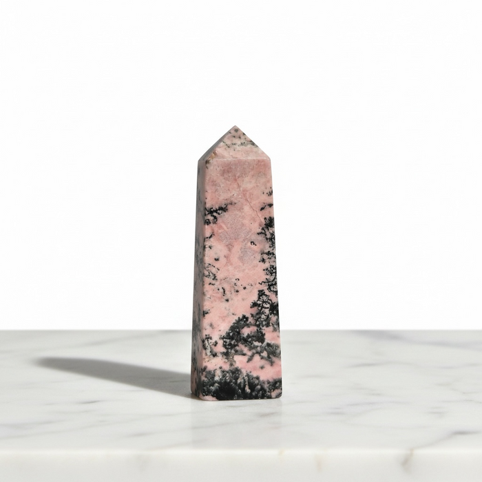 Rhodonite obelisk 156g in vibrant pink with black manganese oxide veining, a powerful crystal tower for love, compassion and root chakra grounding