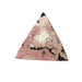 Rhodonite pyramid close-up showing striking pink and black contrast, a healing crystal for love, balance and inner strength