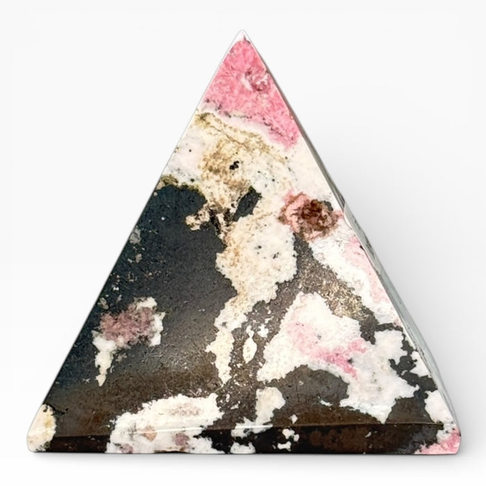 Rhodonite pyramid close-up showing striking pink and black contrast, a healing crystal for emotional strength and compassion