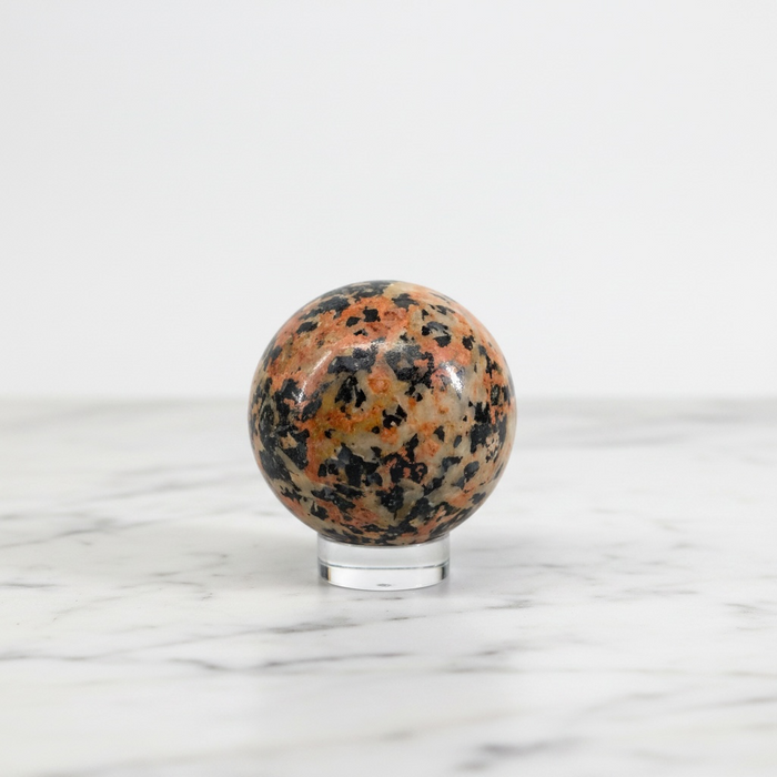 Natural rhodonite and tourmaline polished sphere 237g showing striking pink rhodonite with black tourmaline veining, for love, emotional healing and grounding