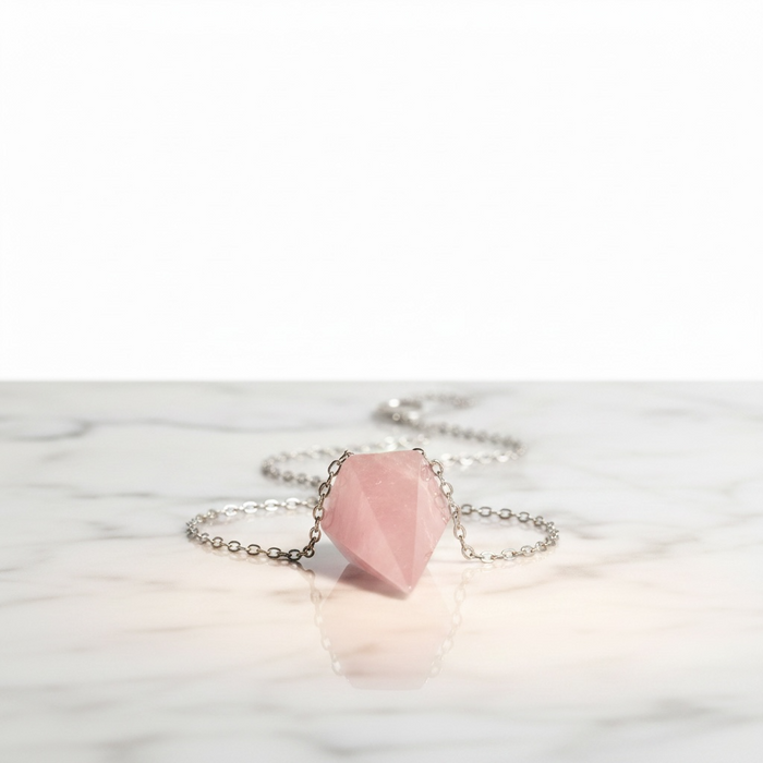Rose quartz crystal pendulum in pale blush pink, the stone of love for emotional healing and compassion
