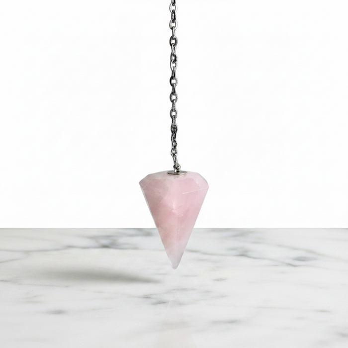 Natural rose quartz faceted pendulum in soft pink, used for dowsing, heart chakra healing and self-love