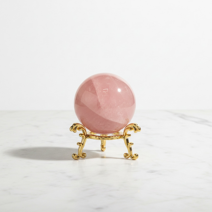 Natural rose quartz crystal sphere in soft blush pink, 134g, radiating love and heart chakra healing energy in all directions