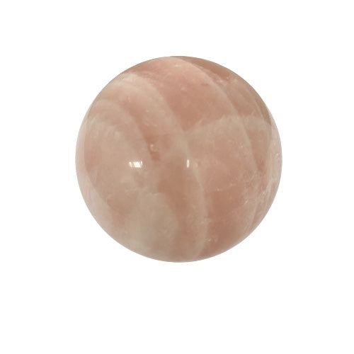 Rose quartz crystal sphere with smooth polished surface in pale pink, the stone of love for emotional healing and harmony