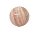 Rose quartz crystal sphere with smooth polished surface in pale pink, the stone of love for emotional healing and harmony