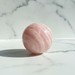 Natural AA grade rose quartz sphere 79mm in soft blush pink, radiating love and heart chakra healing energy