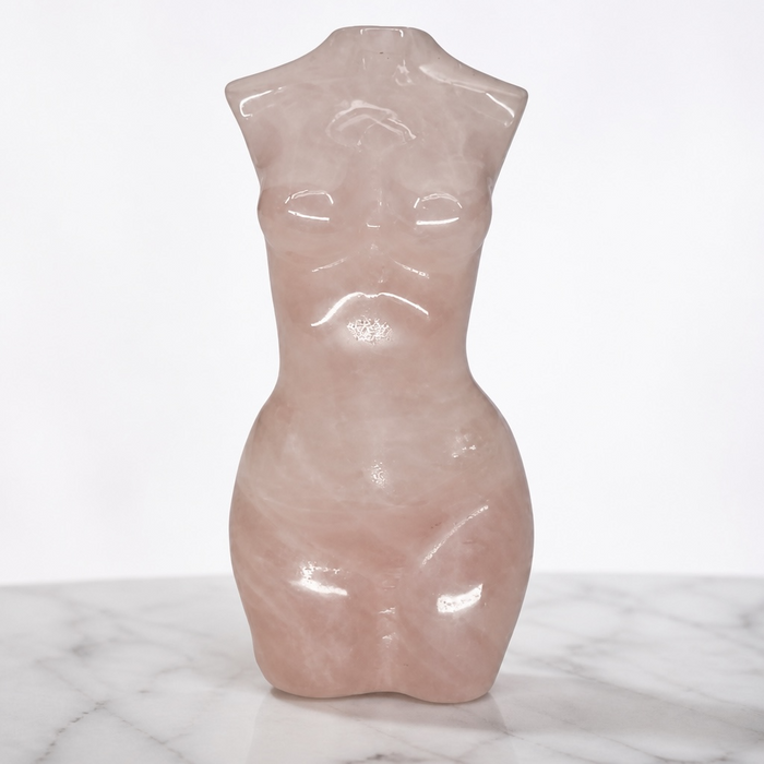 Kindred Crystal Collective — Rose Quartz Female Body Carving, high-gloss polished blush pink Rose Quartz goddess figurine displayed front-facing on white marble surface