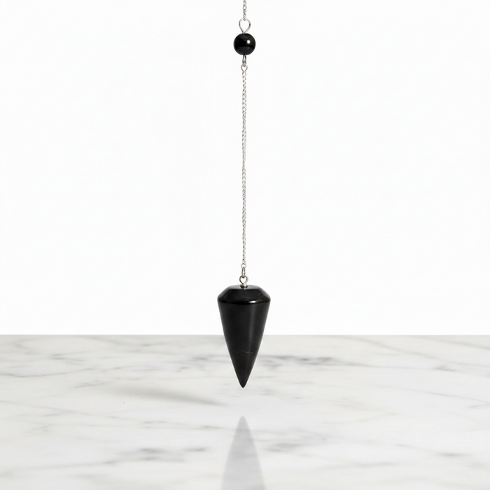 Natural shungite round pendulum in matte black, used for dowsing and EMF protection