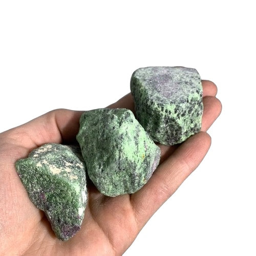 Kindred Crystal Collective — Ruby Zoisite Rough 1KG, large raw green and ruby zoisite chunks held in an open hand showing natural size 4-5cm

