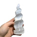 Kindred Crystal Collective — Selenite Spiral Tower, white selenite spiral tower 15cm, size reference with hand showing larger size