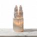 Kindred Crystal Collective - A Selenite Twin Tower Lamp - 30cm lamp with a cylindrical base sits on a white marble surface against a white background.
