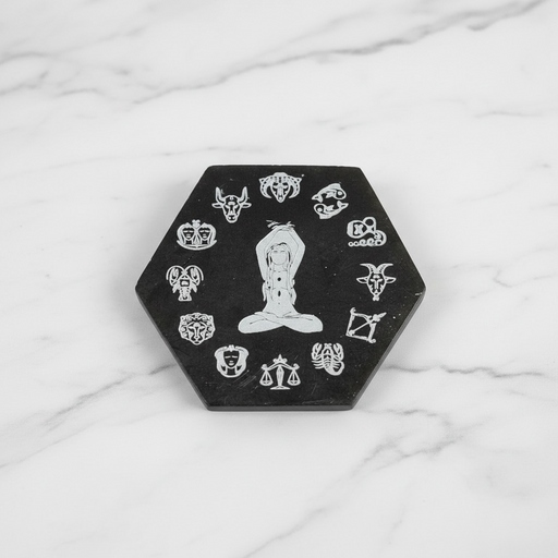 Selenite zodiac plate hexagon in black and white with engraved zodiac symbols, a crystal charging plate for cleansing and protection