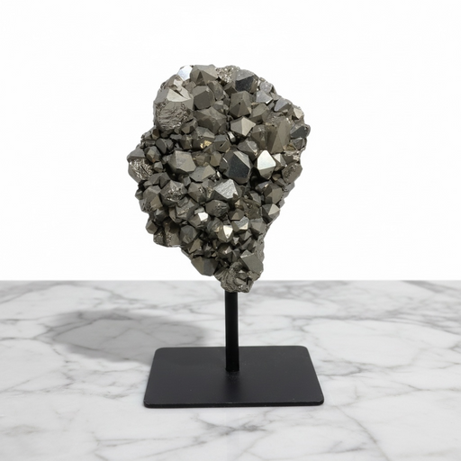 Kindred Crystal Collective - A Silver Titanium Aura Cluster crystal cluster mounted on a black metal stand, displayed on a white marble surface against a white background.