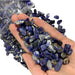 Kindred Crystal Collective — Sodalite Chips 500g, deep blue sodalite chips with white calcite veining in a clear bag on white background