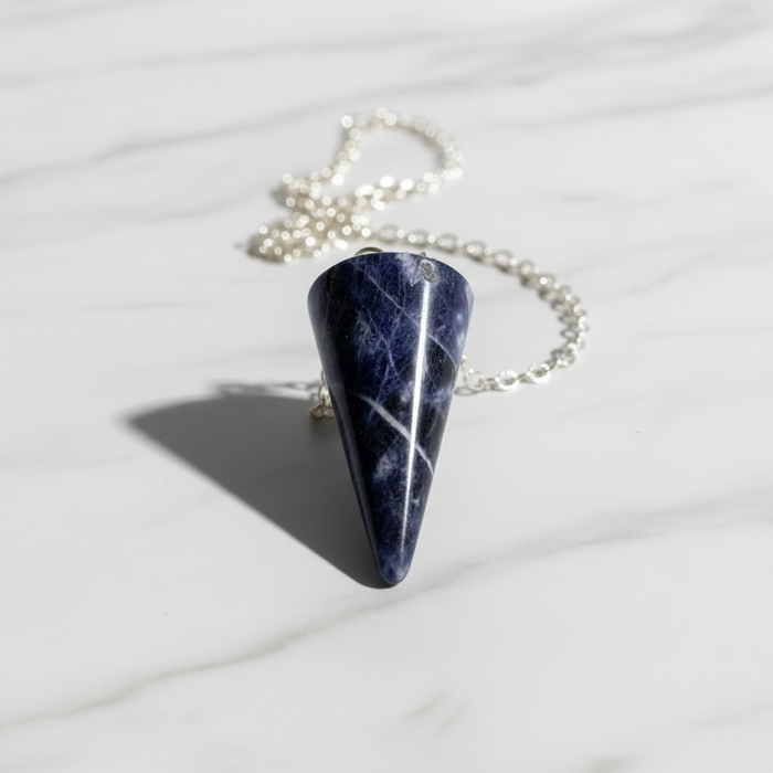 Sodalite crystal pendulum with rich blue tones, faceted point for mental clarity and spiritual perception