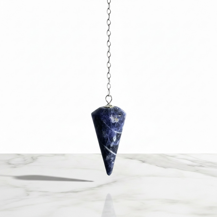 Natural sodalite faceted pendulum in deep blue with white veining, used for dowsing and third eye meditation