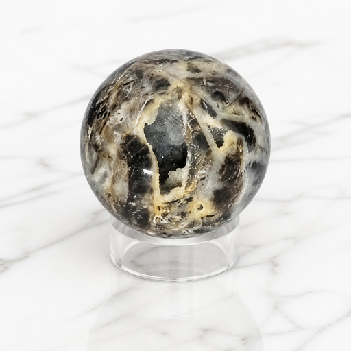 Kindred Crystal Collective — Sphalerite Sphere, natural sphalerite polished sphere in warm amber and honey tones with exceptional refractive brilliance, 70mm
