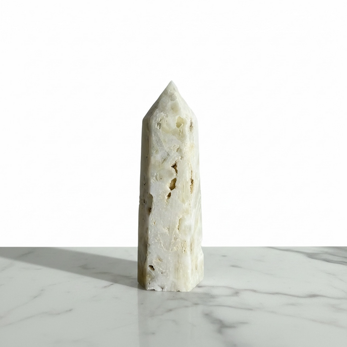 Kindred Crystal Collective — Sphalerite White Generator, polished off-white sphalerite generator point with natural inclusions and textured surface, variant 2