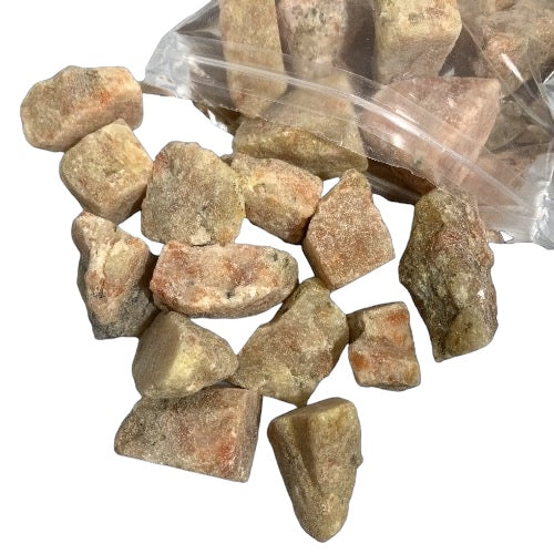 A collection of rough sunstone stones in reddish-orange color, contained within a clear plastic bag.
