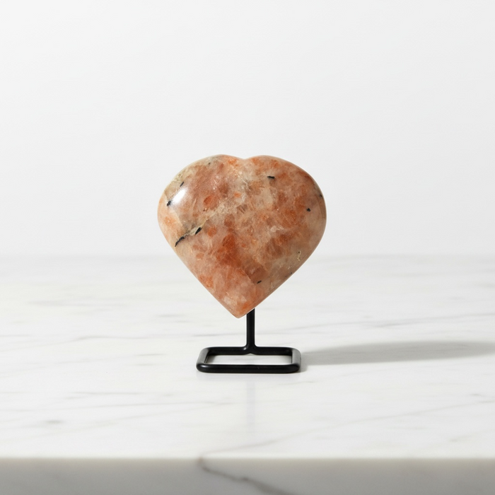 Natural sunstone carved crystal heart in warm reddish-orange with glittering aventurescence, 77g, for vitality and good fortune