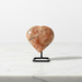 Natural sunstone carved crystal heart in warm reddish-orange with glittering aventurescence, 77g, for vitality and good fortune