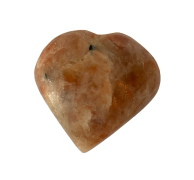 Sunstone crystal heart close-up showing warm orange tones and natural sparkle, a healing crystal for joy, confidence and sacral chakra energy