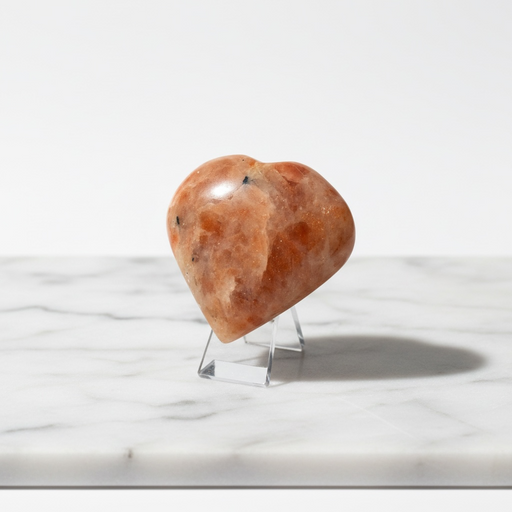 Natural sunstone carved crystal heart in warm reddish-orange with glittering aventurescence, 90g, for vitality and good fortune