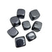 Kindred Crystal Collective - Seven Terahertz square tumbled stones with deep metallic silver-grey colouring and a high-gloss mirror-like polished finish.