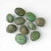 Kindred Crystal Collective — Variscite Tumbled Stones, ten polished bright mid-green to vivid green Variscite tumbles showing warm amber-brown matrix patches and mottled patterning with high-gloss finish, white background