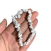 Kindred Crystal Collective — White Howlite Chip Bracelets (Pack of 5), polished white stone chips with delicate grey veining and a soft marble-like appearance.