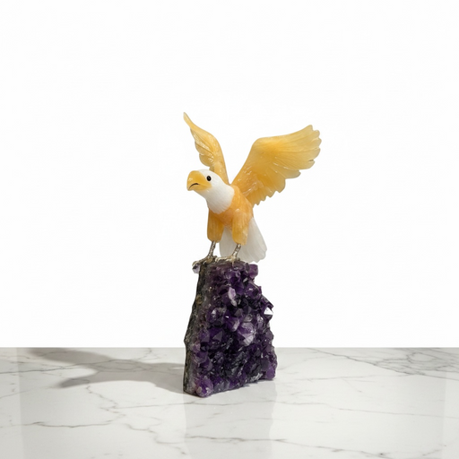 Kindred Crystal Collective — Yellow and White Calcite Eagle, close-up of carved yellow and white calcite eagle with wings spread