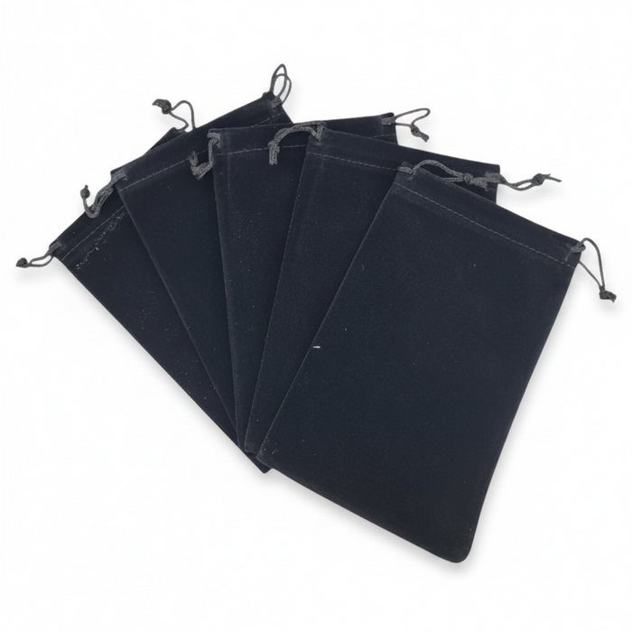 Black velvet drawstring bags on a white background