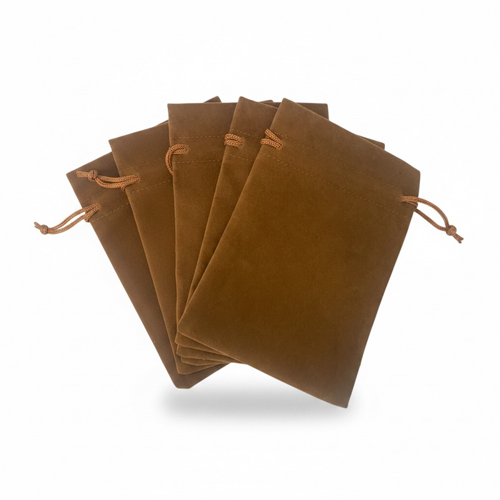 Set of brown velvet drawstring bags on a white background