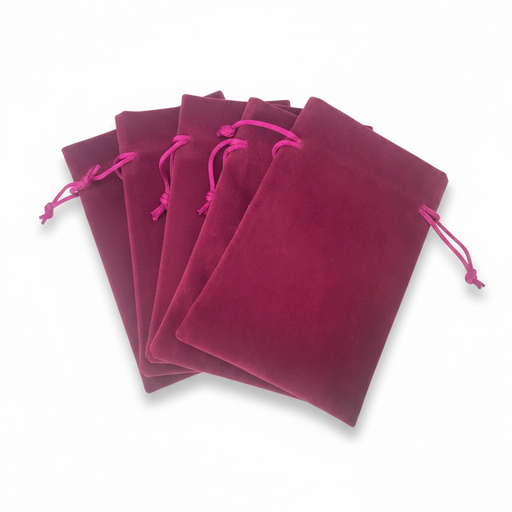 Set of magenta velvet drawstring bags on a white background