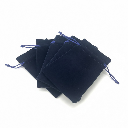 Set of dark blue velvet drawstring bags on a white background