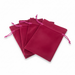 Set of pink velvet drawstring bags on a white background