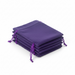 Stack of purple drawstring bags on a white background