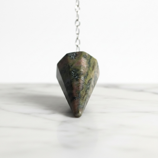 Unakite Pendulum - Pink Based crystal on white background distinctive pink and green tones