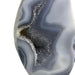 Kindred Crystal Collective — Agate Druzy Flame, close-up of sparkling grey druzy crystal cavity with concentric agate banding, variant 1